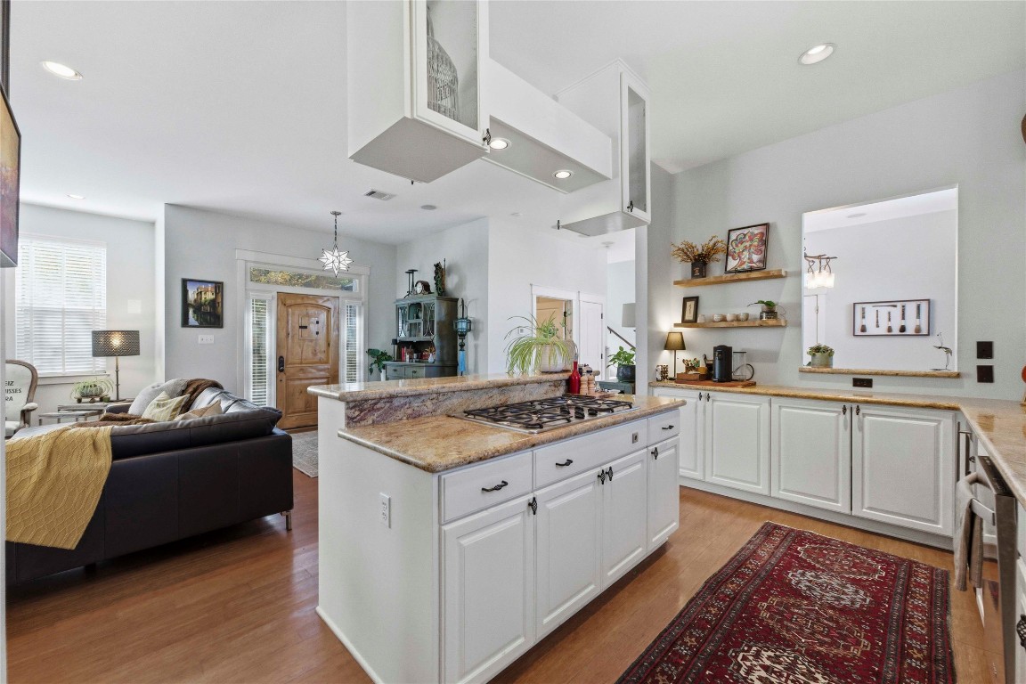 2128 Sage Creek Loop Austin, TX 78704 - Photo 31 of 32 a open kitchen with stainless steel appliances granite countertop a lot of counter space and wooden floor