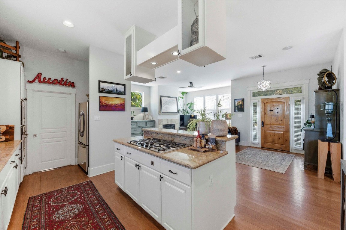 2128 Sage Creek Loop Austin, TX 78704 - Photo 32 of 32 a kitchen with stainless steel appliances granite countertop a stove and a refrigerator