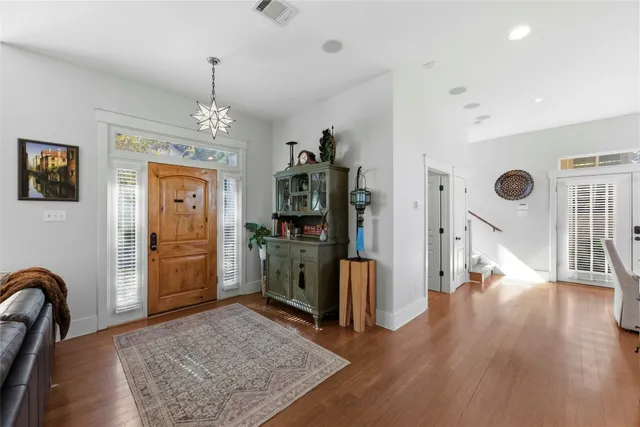 a kitchen with stainless steel appliances granite countertop a stove and a refrigerator