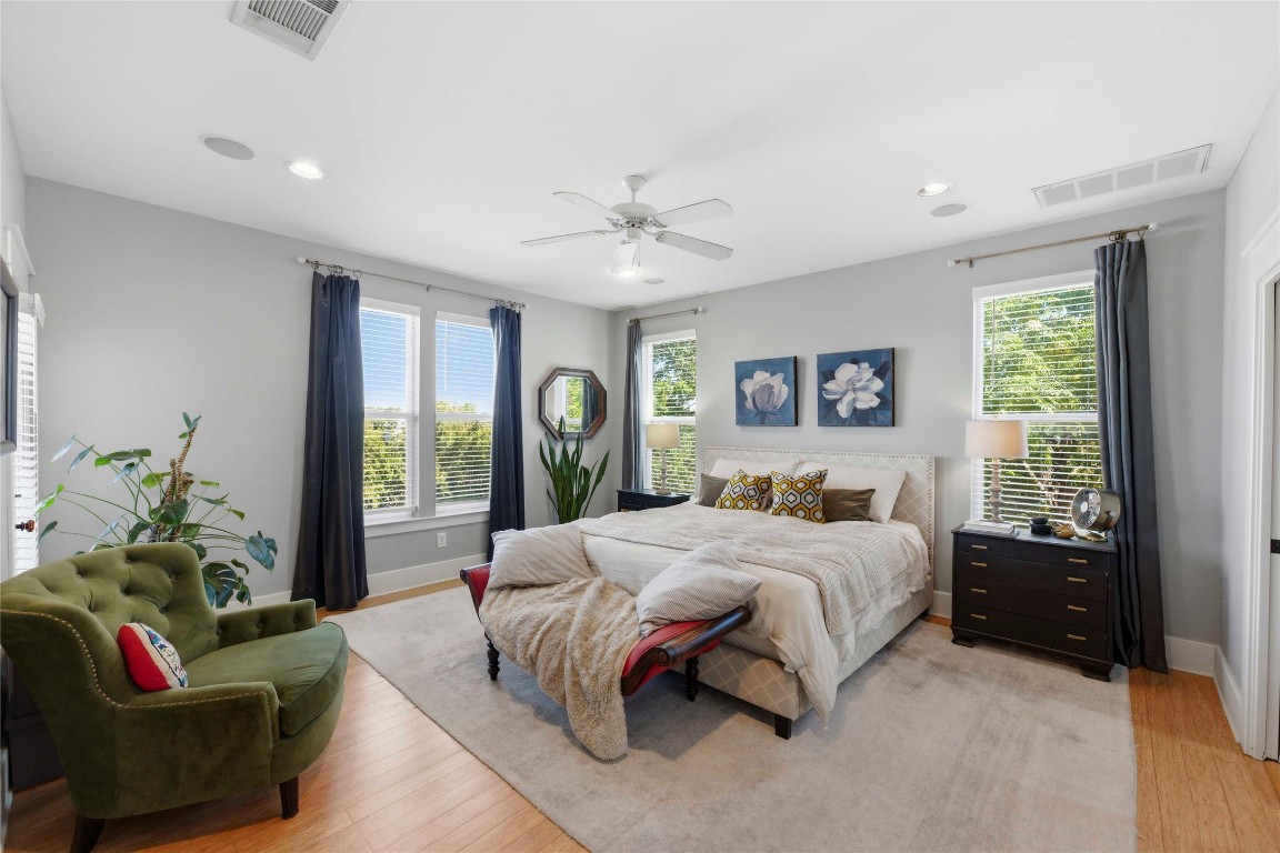 2128 Sage Creek Loop Austin, TX 78704 - Photo 15 of 32 a bedroom with a bed couch and window