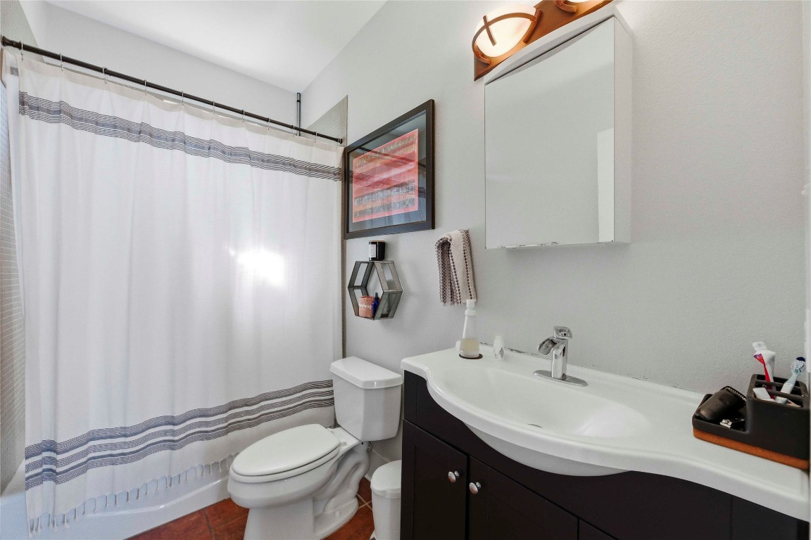2128 Sage Creek Loop Austin, TX 78704 - Photo 20 of 32 a bathroom with a sink toilet and shower