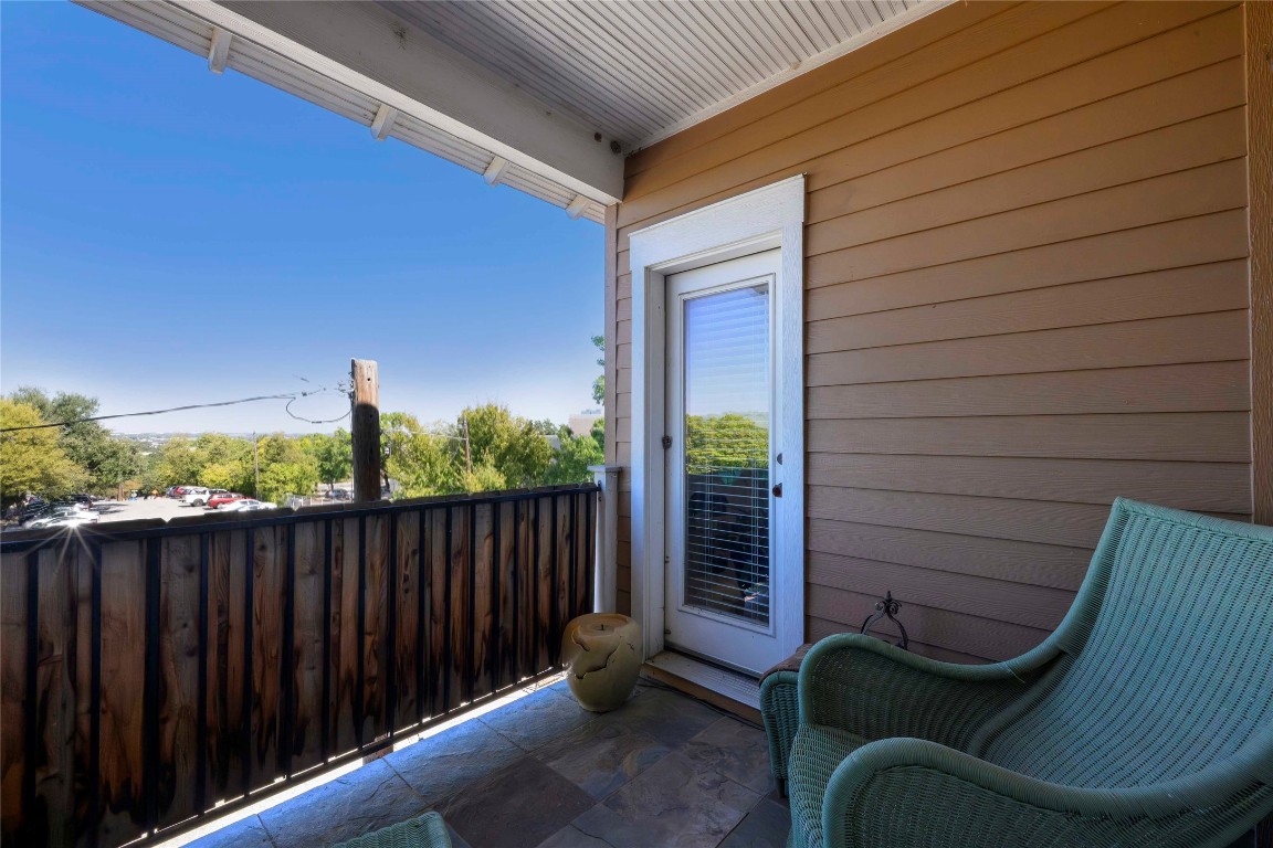 2128 Sage Creek Loop Austin, TX 78704 - Photo 24 of 32 a view of a chair in the balcony