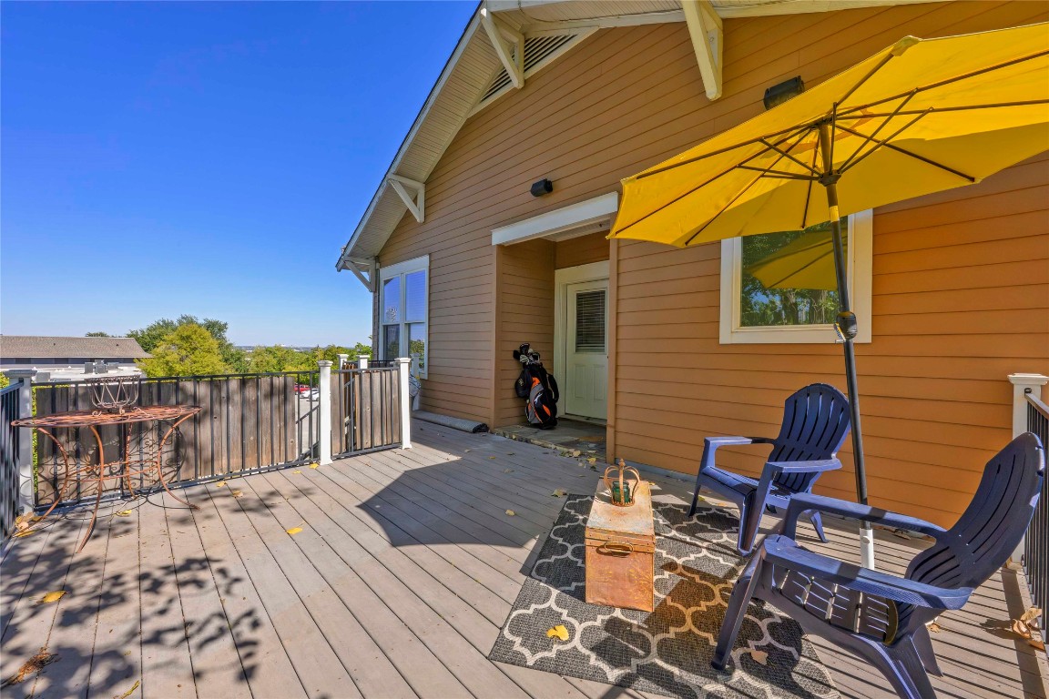 2128 Sage Creek Loop Austin, TX 78704 - Photo 25 of 32 a view of a patio with a table and chairs