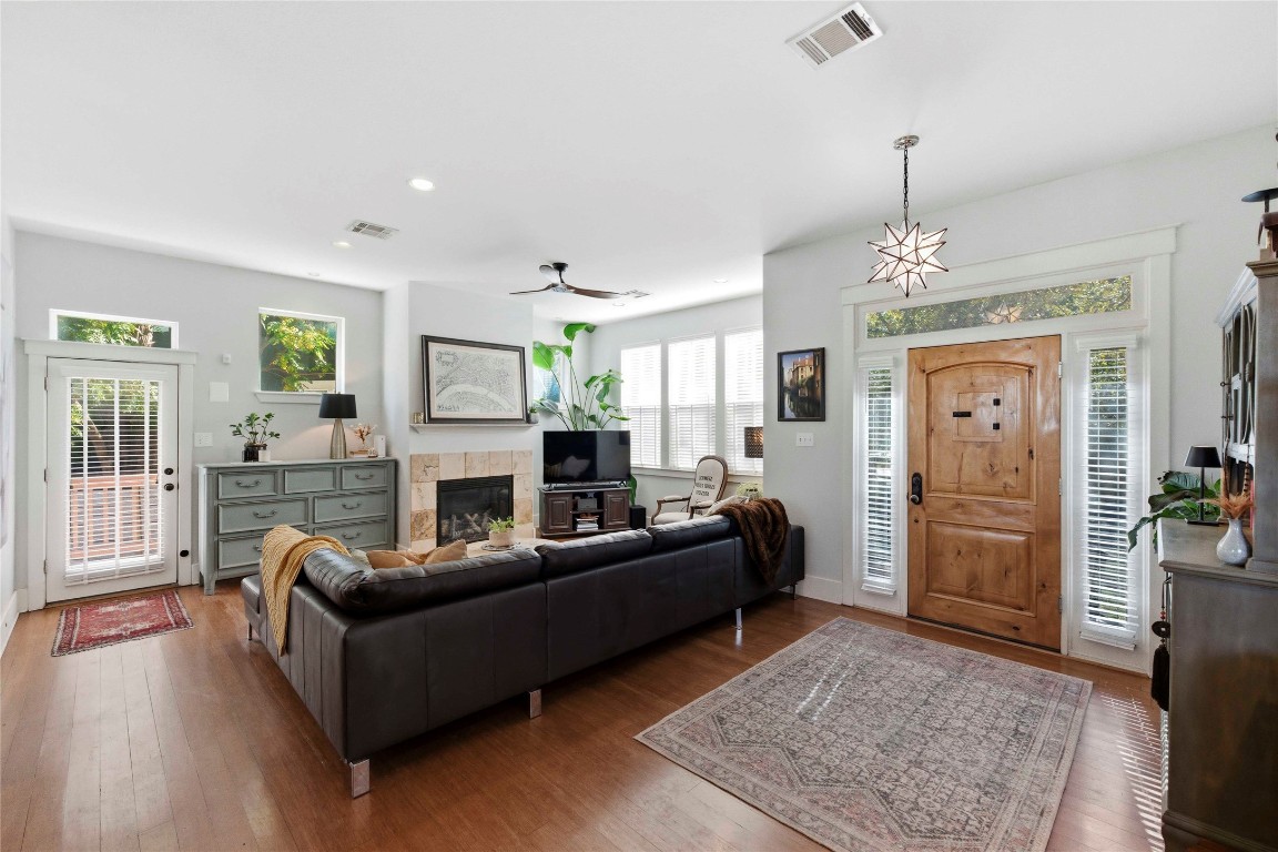 2128 Sage Creek Loop Austin, TX 78704 - Photo 3 of 32 a living room with furniture and a chandelier