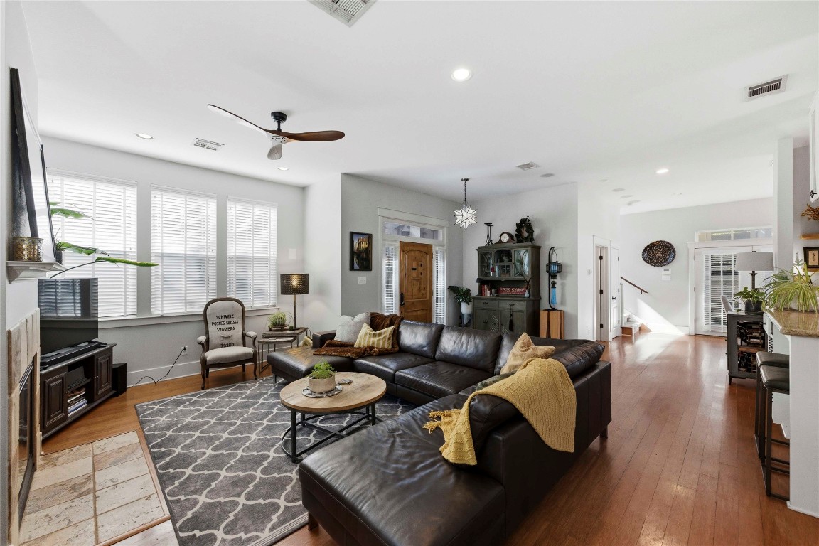 2128 Sage Creek Loop Austin, TX 78704 - Photo 5 of 32 a living room with fireplace furniture and a large window