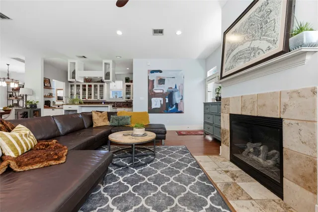 a living room with furniture and a fireplace