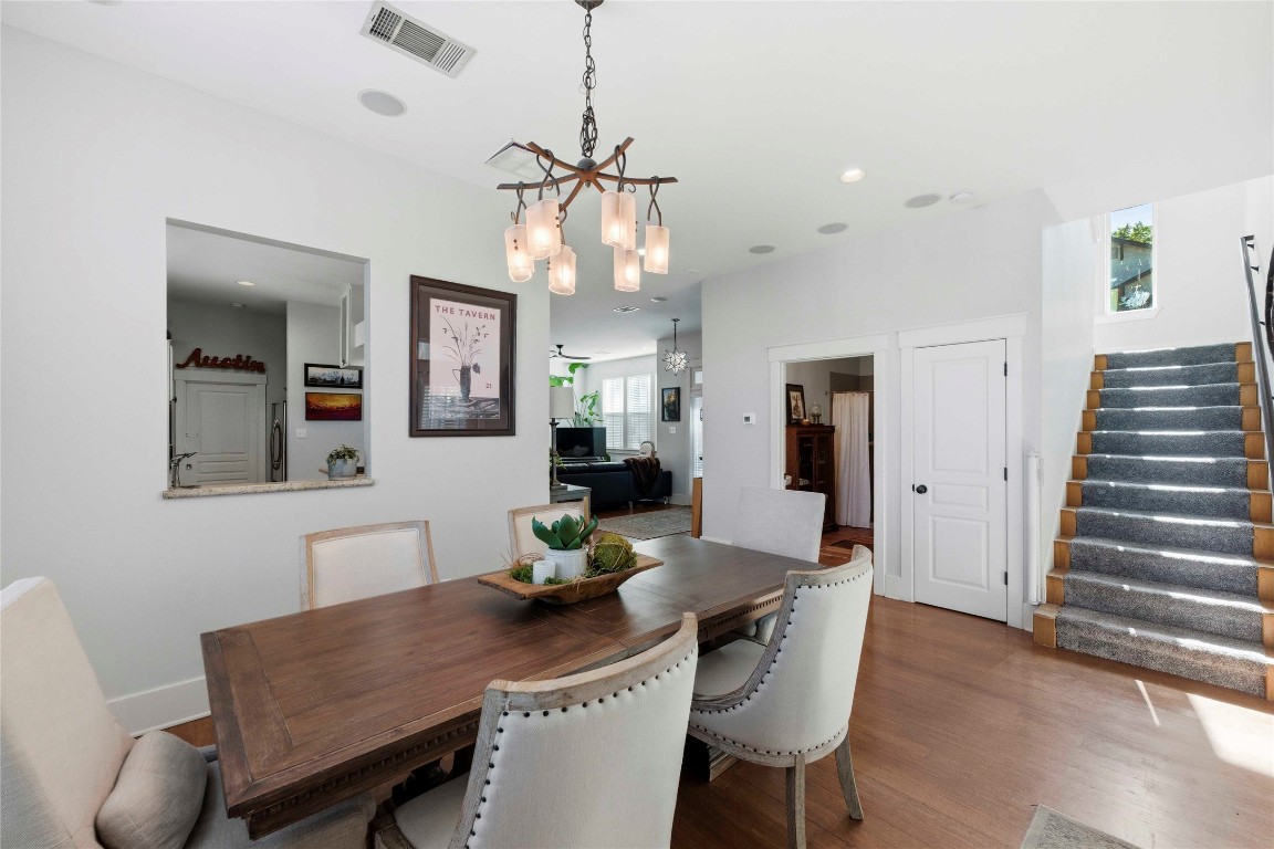 2128 Sage Creek Loop Austin, TX 78704 - Photo 8 of 32 a view of a dining room with furniture and wooden floor