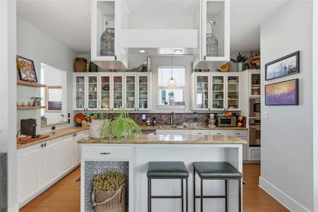 a kitchen with a sink and a refrigerator