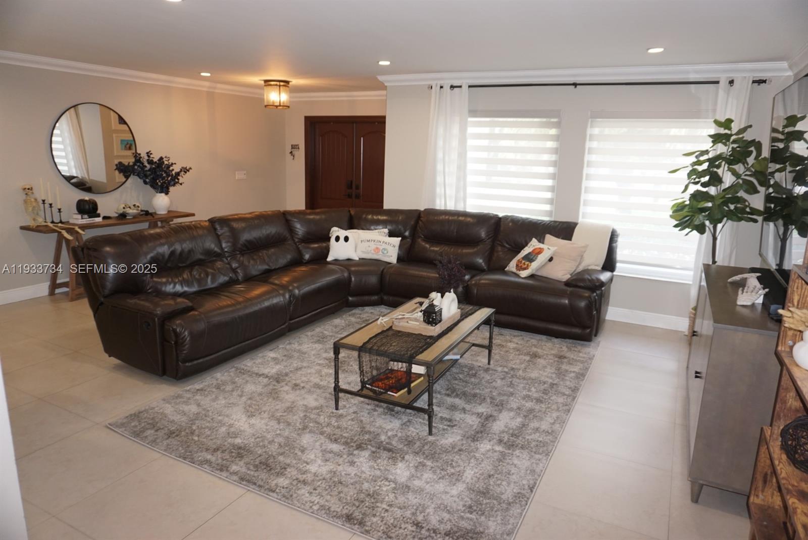 10350 Southwest 16th Street Miami, FL 33165 - Photo 11 of 48 a living room with furniture and a large window