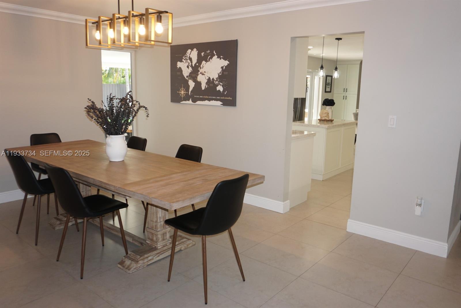 10350 Southwest 16th Street Miami, FL 33165 - Photo 19 of 48 a view of a dining room with furniture and chandelier