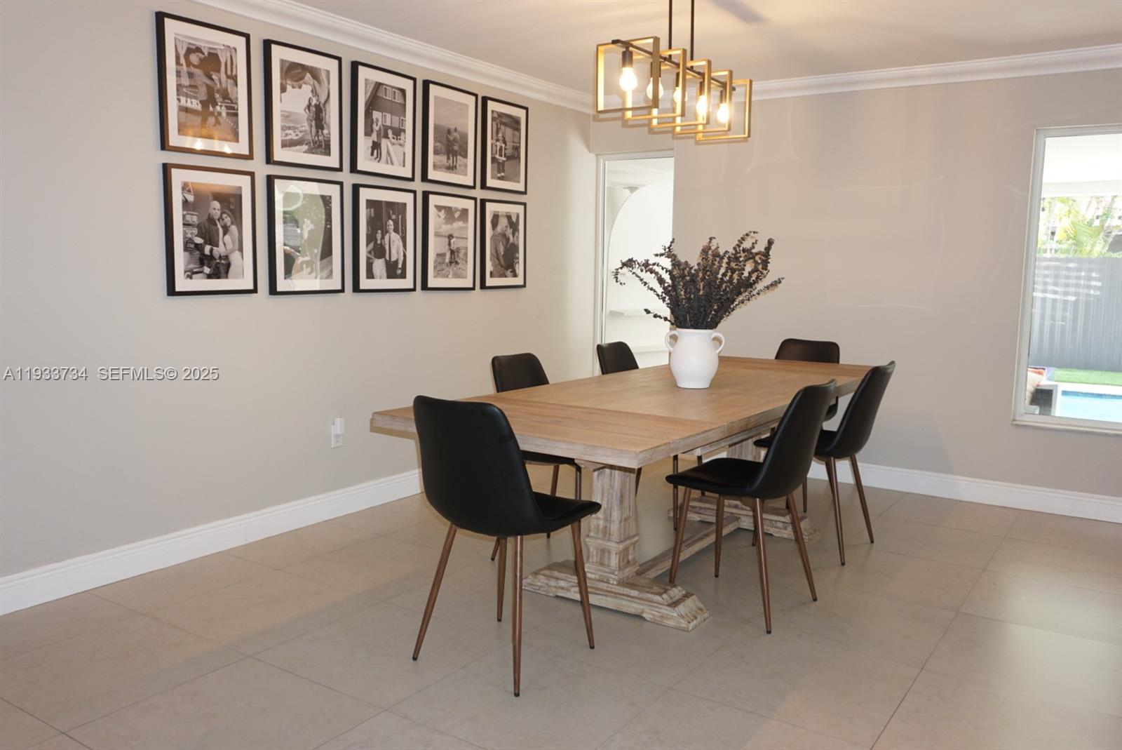 10350 Southwest 16th Street Miami, FL 33165 - Photo 20 of 48 a view of a dining room with furniture a chandelier and wooden floor