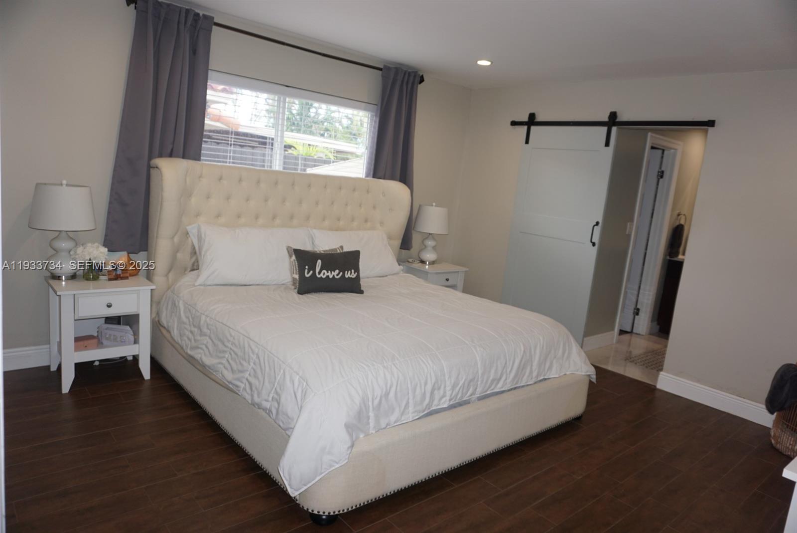 10350 Southwest 16th Street Miami, FL 33165 - Photo 27 of 48 a bedroom with a bed and a window