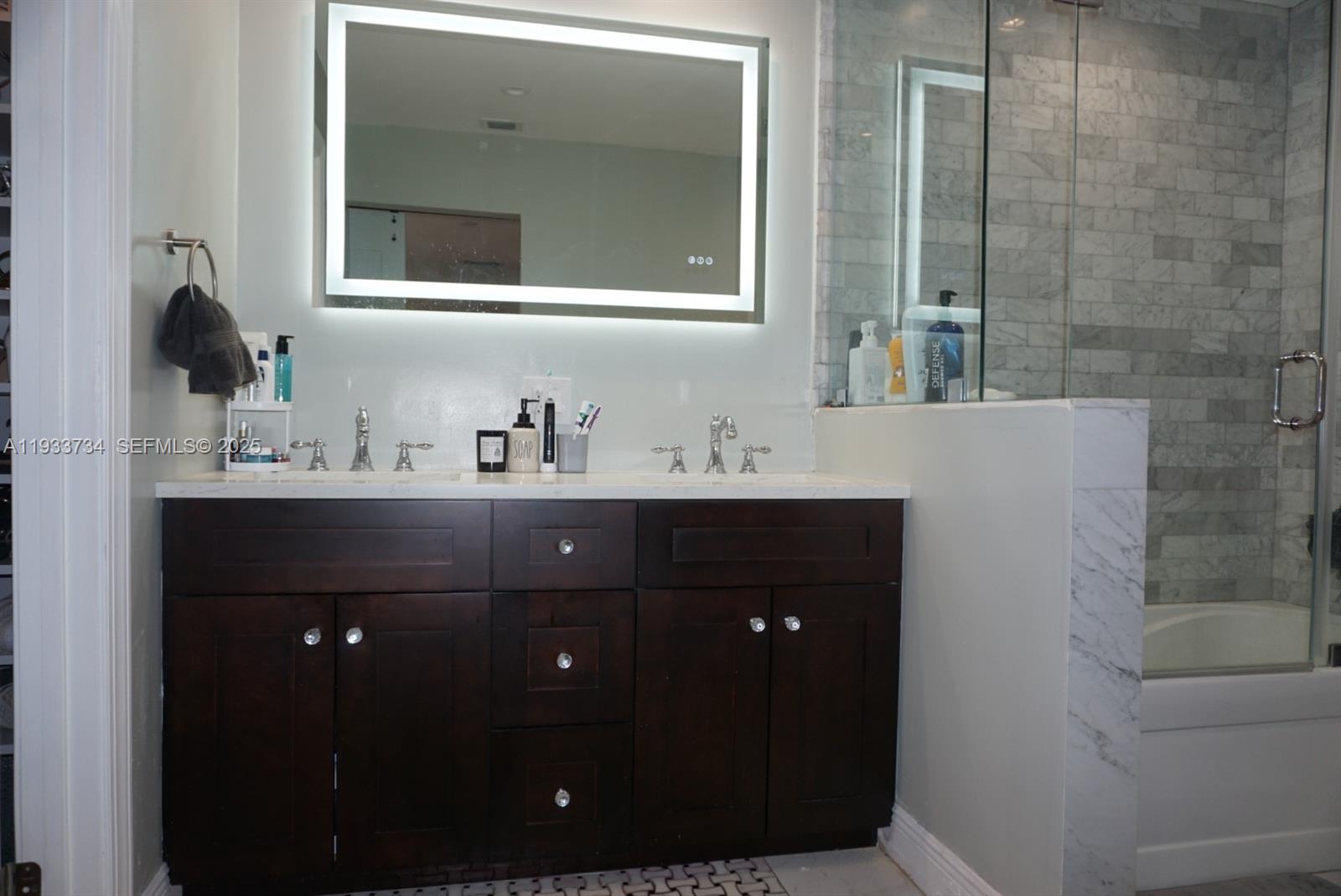 10350 Southwest 16th Street Miami, FL 33165 - Photo 32 of 48 a bathroom with a sink vanity and mirror