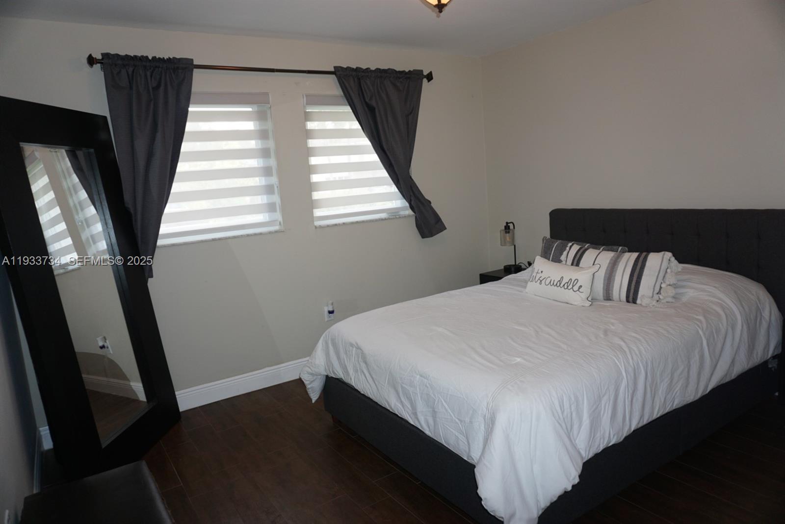 10350 Southwest 16th Street Miami, FL 33165 - Photo 33 of 48 a bedroom with a bed and a window