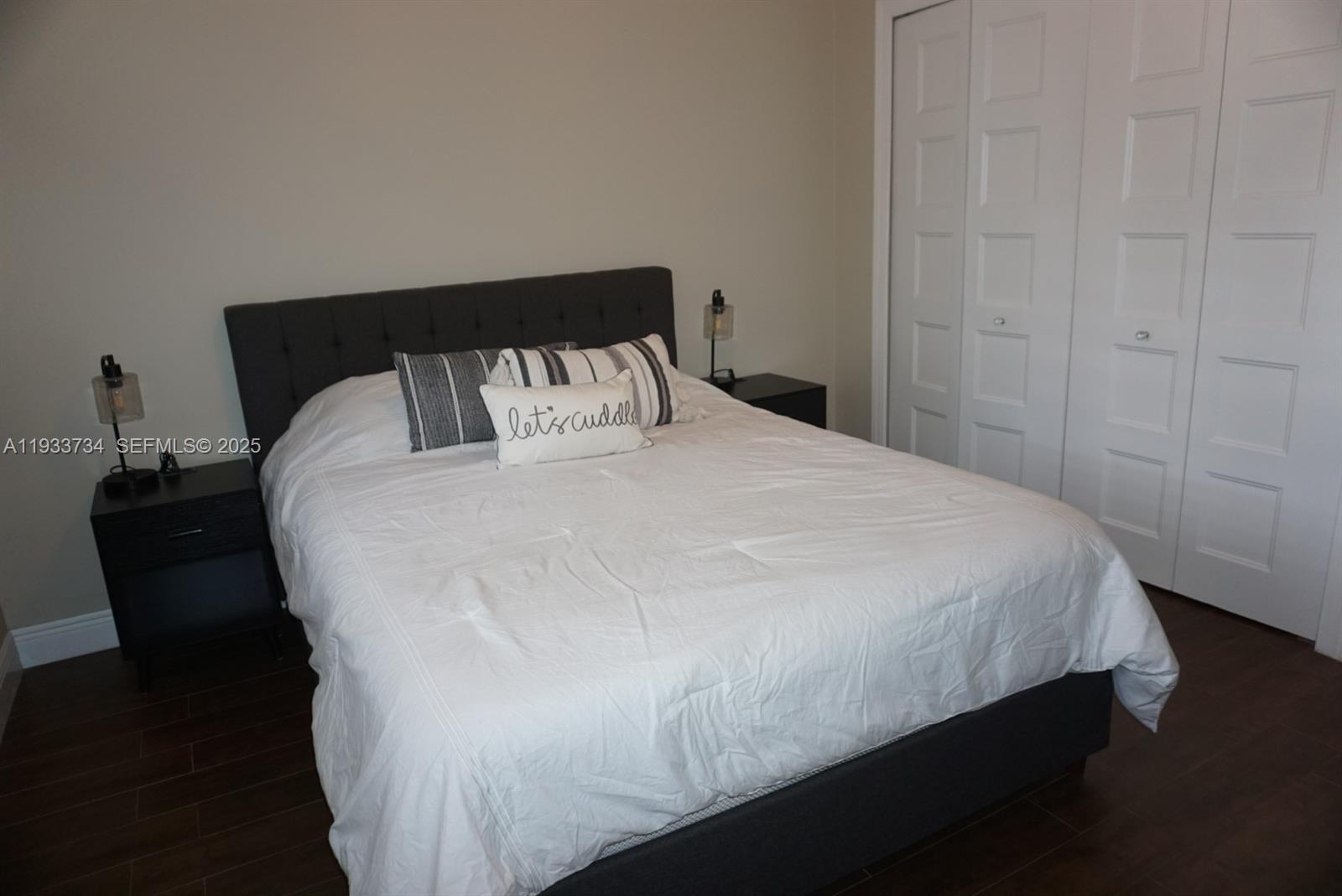 10350 Southwest 16th Street Miami, FL 33165 - Photo 34 of 48 a large bed sitting in a bedroom next to a cabinet