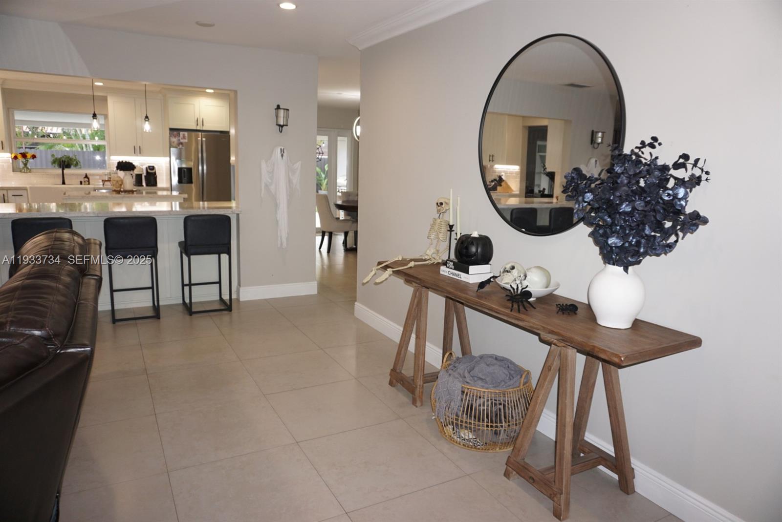 10350 Southwest 16th Street Miami, FL 33165 - Photo 4 of 48 a kitchen with a sink a table and chairs