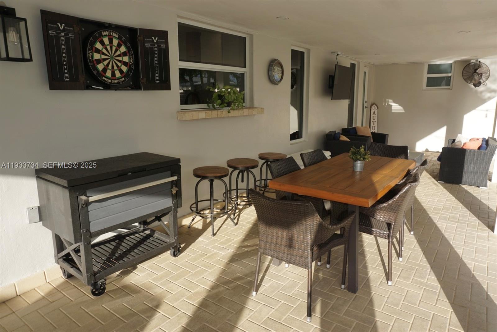10350 Southwest 16th Street Miami, FL 33165 - Photo 44 of 48 a living room with furniture and a flat screen tv