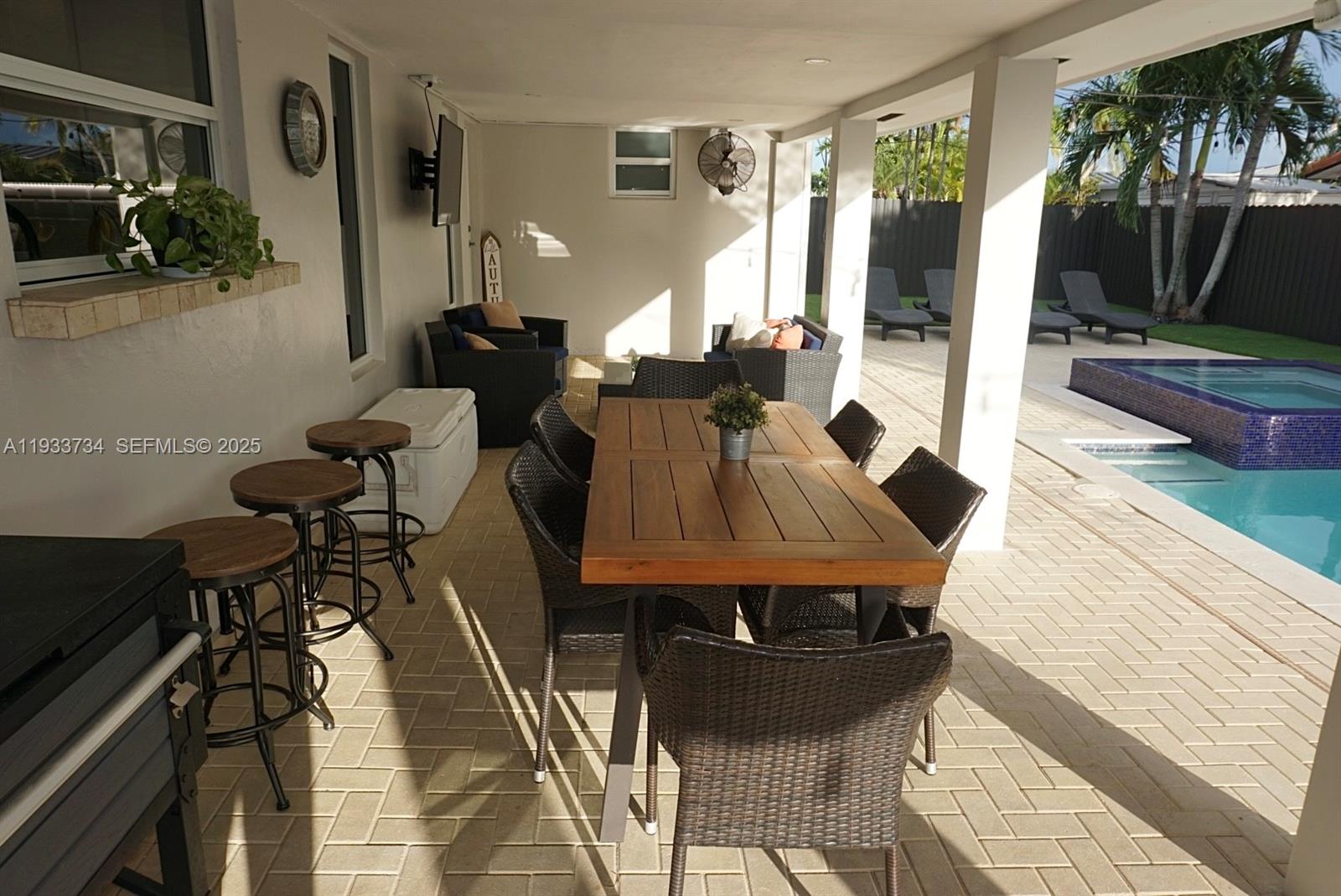 10350 Southwest 16th Street Miami, FL 33165 - Photo 45 of 48 a living room with furniture and a flat screen tv