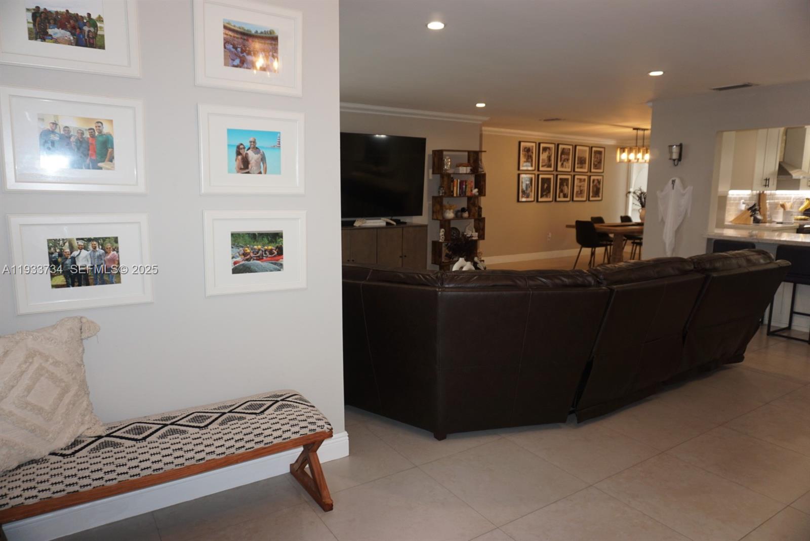 10350 Southwest 16th Street Miami, FL 33165 - Photo 9 of 48 a living room with furniture and a flat screen tv