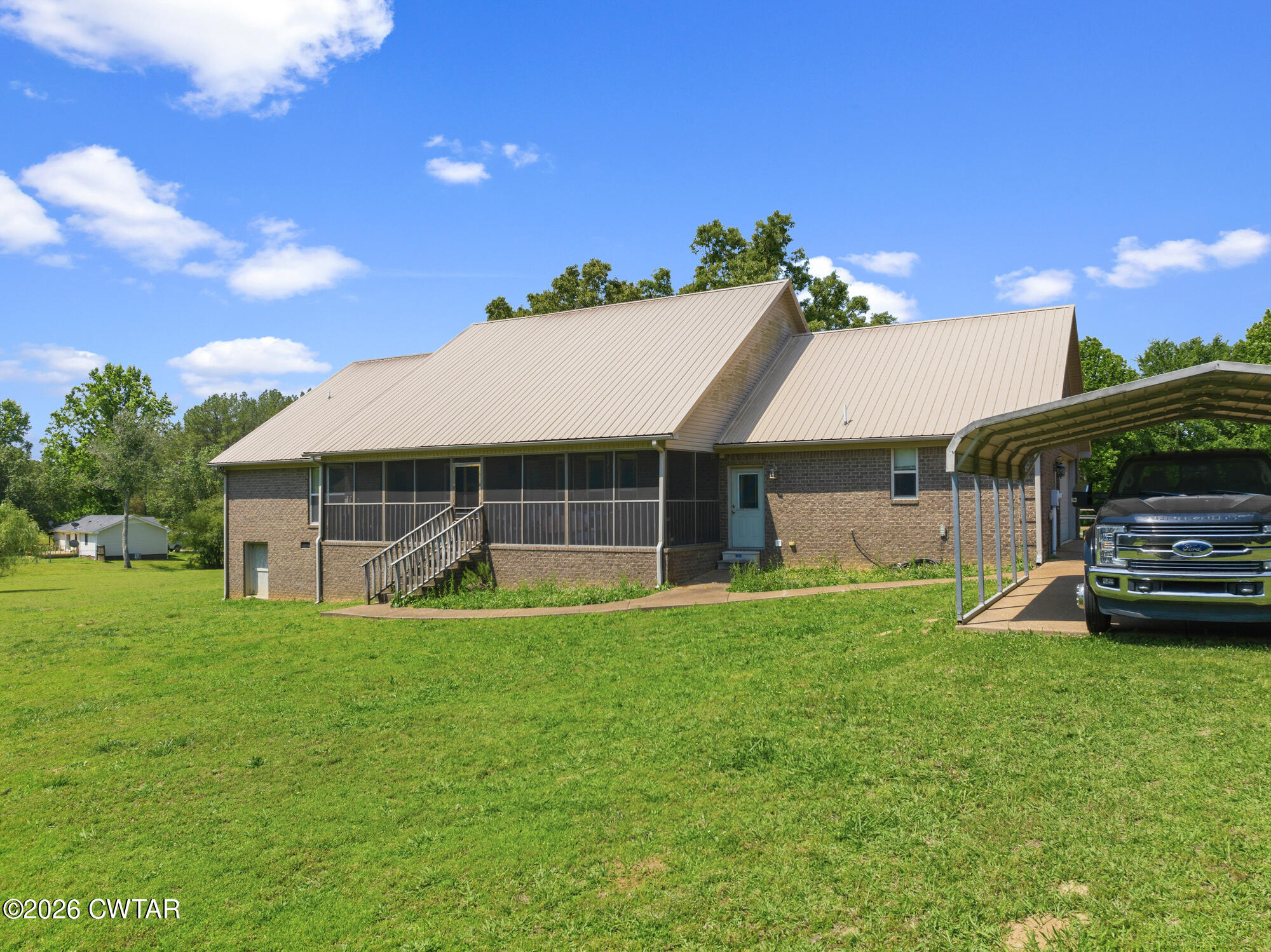 492 Joe Horton Road Lexington, TN 38351 - Photo 47 of 49 a view of a house with a yard
