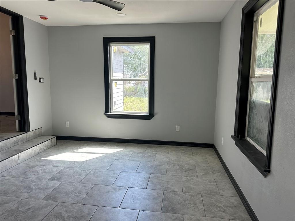 300 East Le Roy Street Three Rivers, TX 78071 - Photo 5 of 15 a view of an empty room with a window