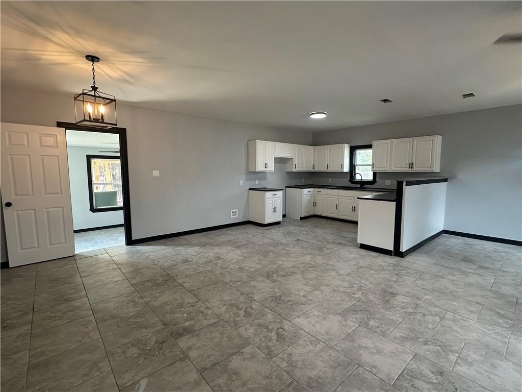 300 East Le Roy Street Three Rivers, TX 78071 - Photo 8 of 15 a kitchen with stainless steel appliances granite countertop a stove and a refrigerator