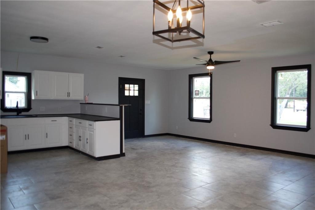 300 East Le Roy Street Three Rivers, TX 78071 - Photo 10 of 15 a large white kitchen with a window