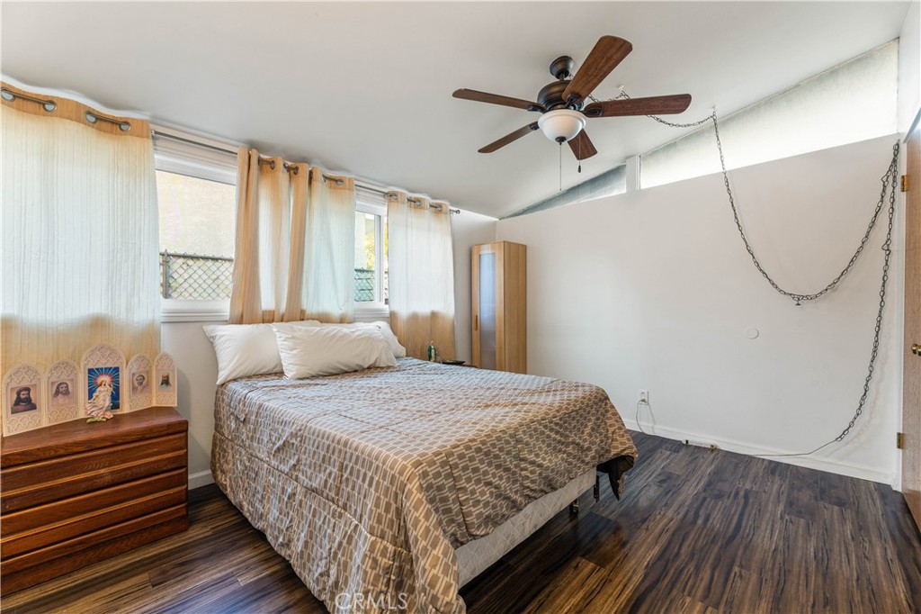 3340 East Poppy Street Long Beach, CA 90805 - Photo 15 of 39 a bedroom with a bed and window