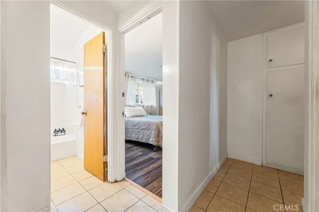 a bathroom with a tub a sink and window