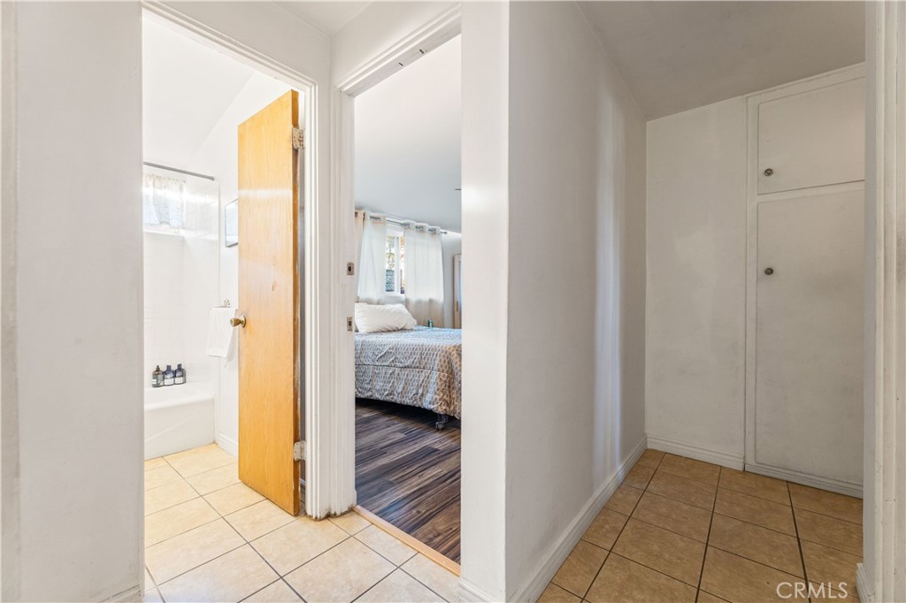 3340 East Poppy Street Long Beach, CA 90805 - Photo 19 of 39 a view of a bathroom from a hallway