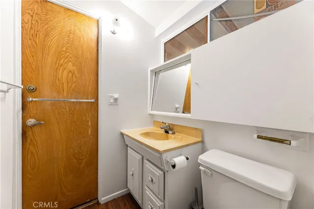 a kitchen with a refrigerator and a sink