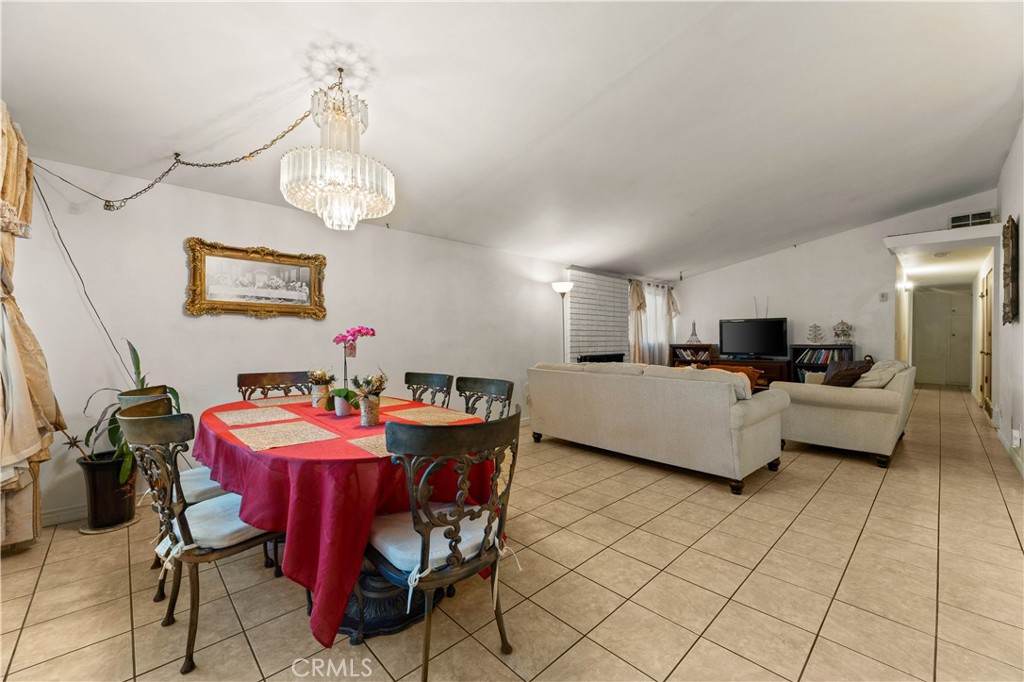 3340 East Poppy Street Long Beach, CA 90805 - Photo 32 of 39 a living room with furniture and a dining table