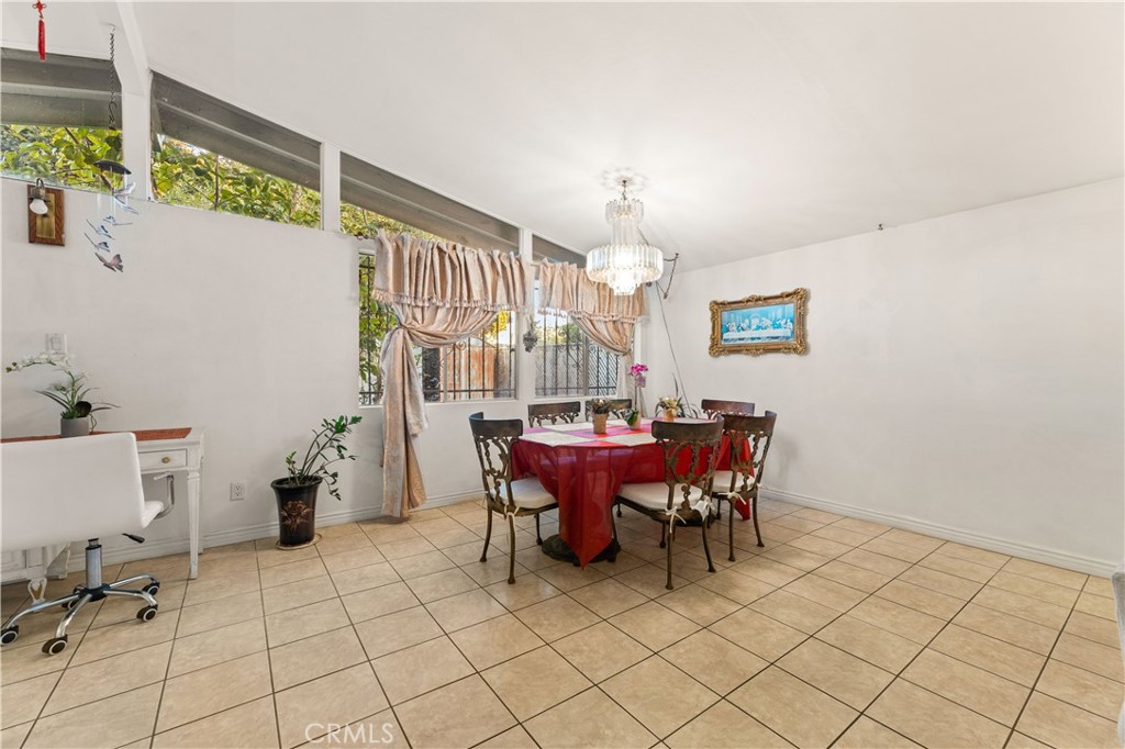 3340 East Poppy Street Long Beach, CA 90805 - Photo 33 of 39 a view of a dining room with furniture