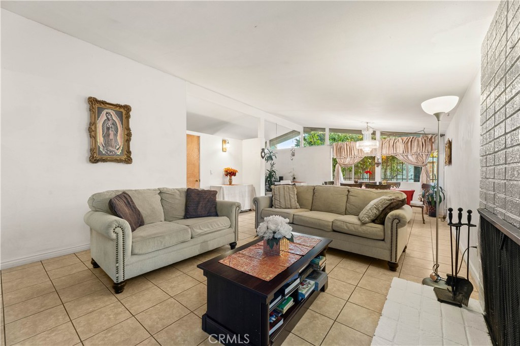 3340 East Poppy Street Long Beach, CA 90805 - Photo 35 of 39 a living room with furniture and a table