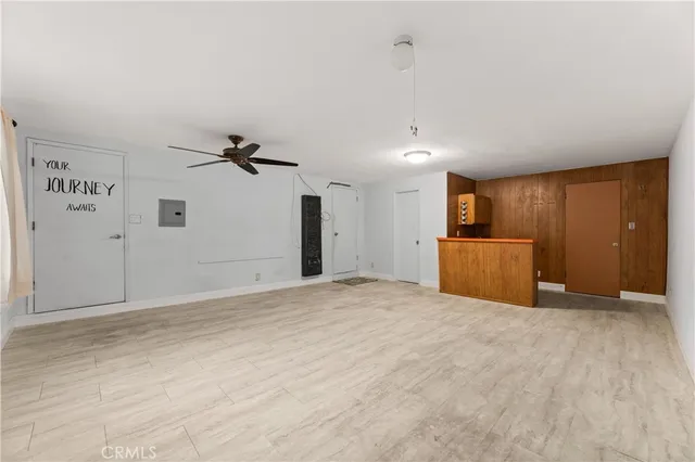 a view of an empty room with a cabinet