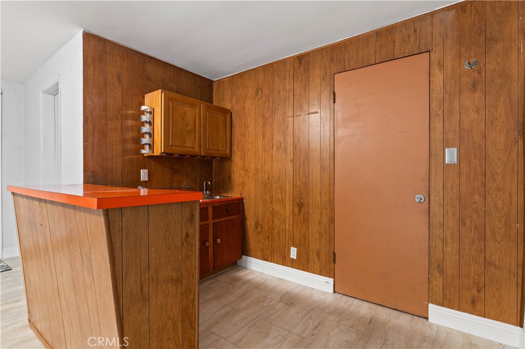 3340 East Poppy Street Long Beach, CA 90805 - Photo 10 of 39 a bathroom with a mirror and a shower curtain