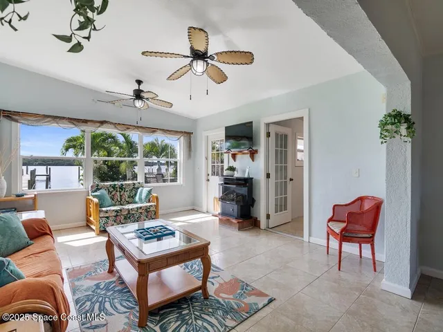 a living room with furniture a window and a table
