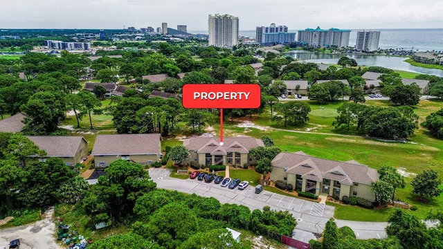 an aerial view of residential building and lake