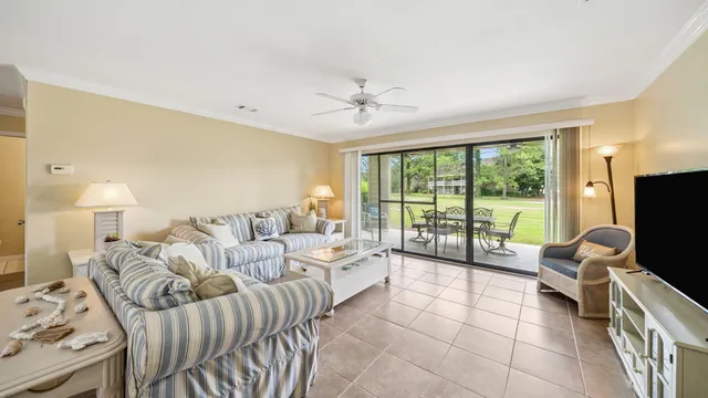 a bedroom with furniture and a flat screen tv