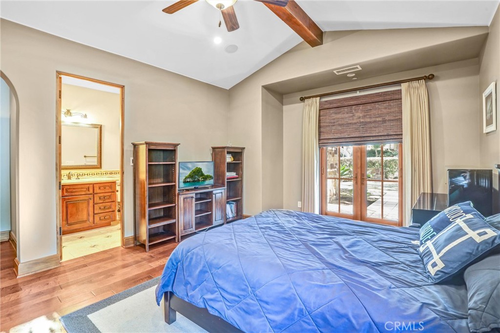 41 Needle Grass Irvine, CA 92603 - Photo 18 of 64 a bedroom with a large bed and a wooden floor