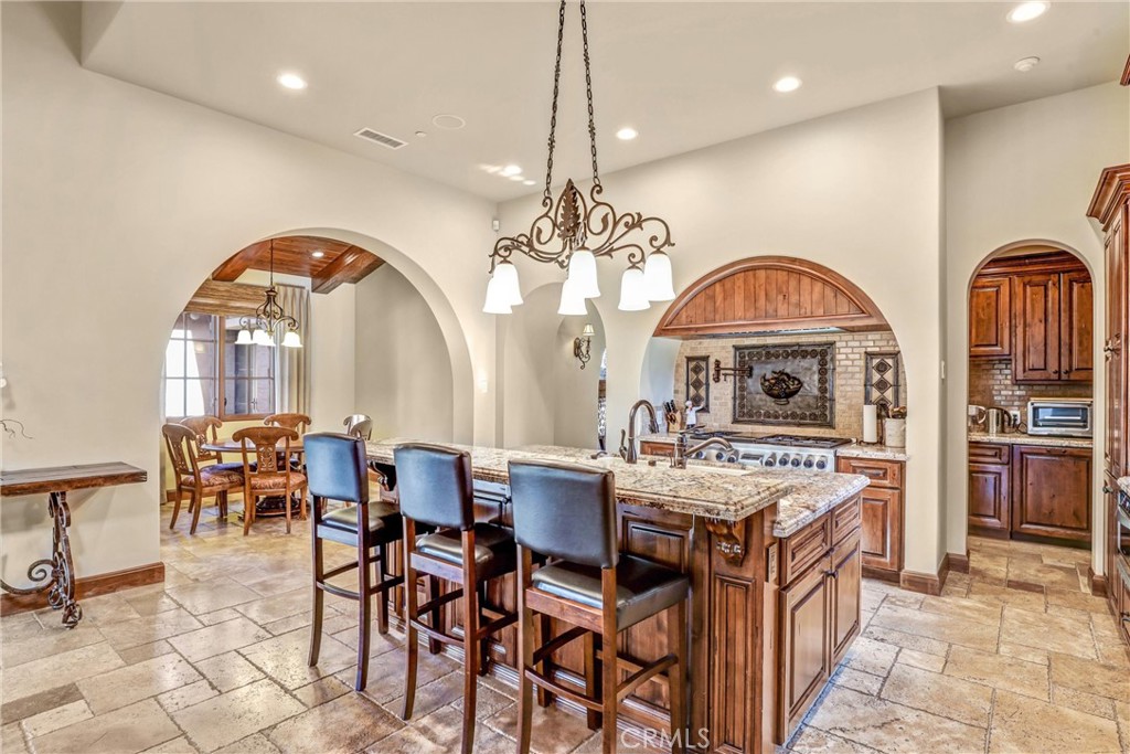 41 Needle Grass Irvine, CA 92603 - Photo 22 of 64 a view of a dining room with furniture and chandelier