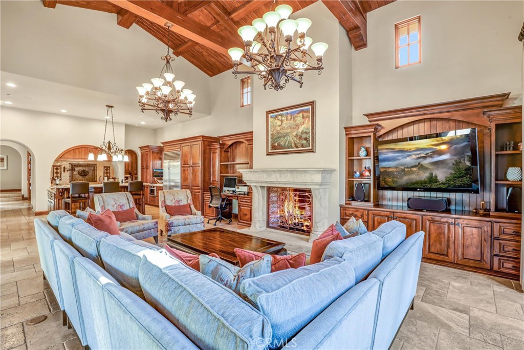 41 Needle Grass Irvine, CA 92603 - Photo 27 of 64 a living room with fireplace furniture and a flat screen tv