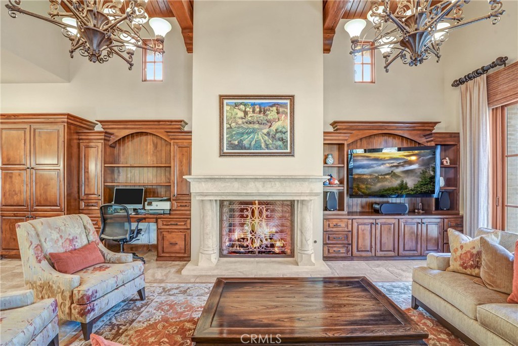 41 Needle Grass Irvine, CA 92603 - Photo 29 of 64 a living room with furniture a fireplace and a flat screen tv