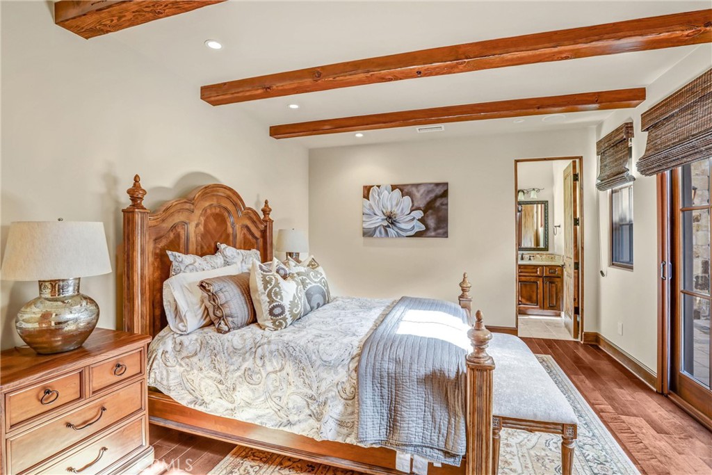 41 Needle Grass Irvine, CA 92603 - Photo 31 of 64 a bedroom with a bed and wooden floor