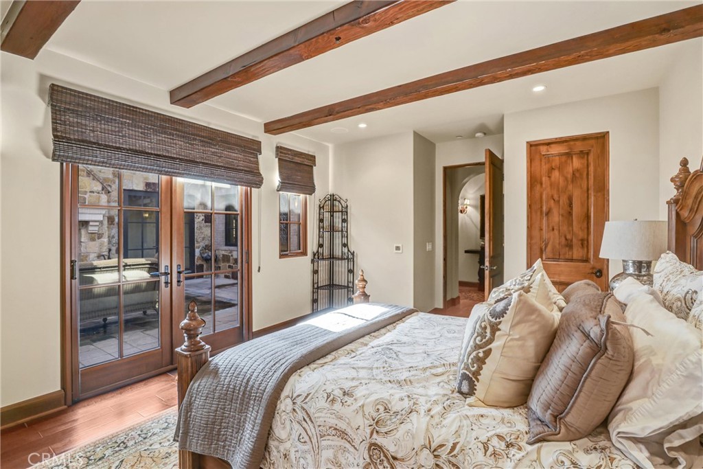 41 Needle Grass Irvine, CA 92603 - Photo 32 of 64 a bedroom with a large bed and glass door