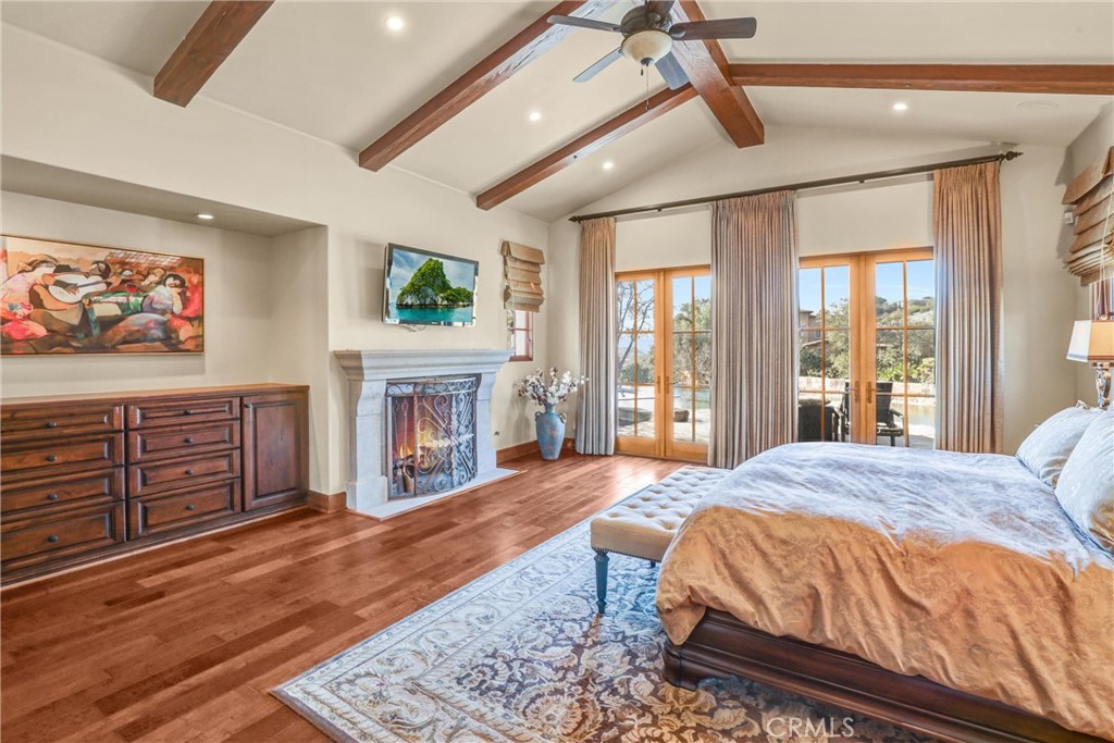 41 Needle Grass Irvine, CA 92603 - Photo 36 of 64 a spacious bedroom with a bed and a dresser next to a window