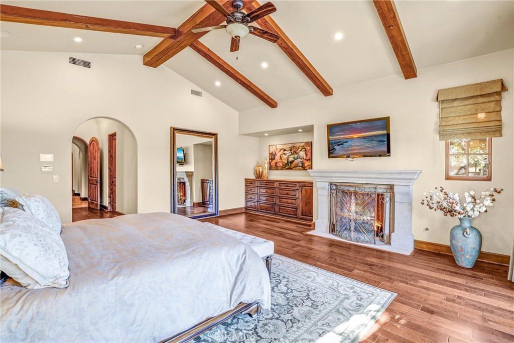 41 Needle Grass Irvine, CA 92603 - Photo 38 of 64 a spacious bedroom with a bed and a fireplace