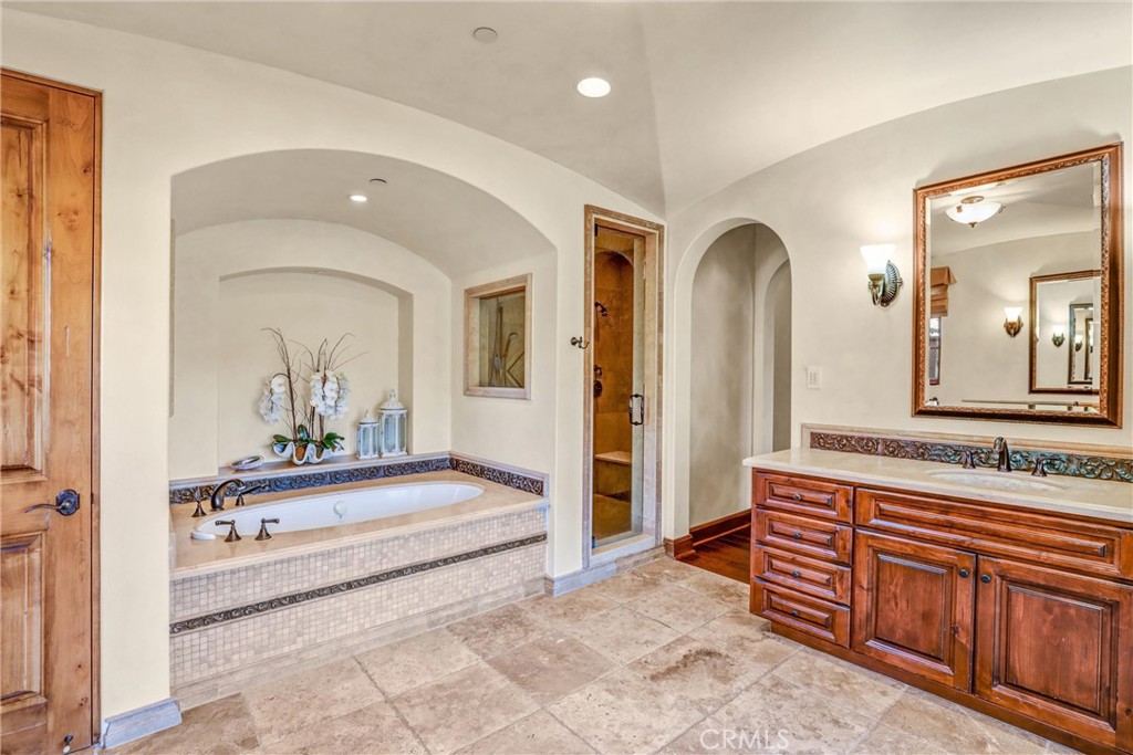 41 Needle Grass Irvine, CA 92603 - Photo 40 of 64 a spacious bathroom with a double vanity sink and a mirror