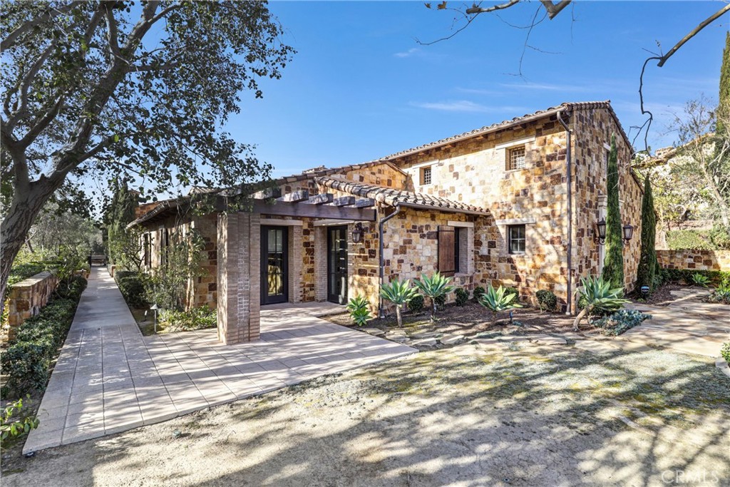 41 Needle Grass Irvine, CA 92603 - Photo 44 of 64 a view of a house with a tree in front