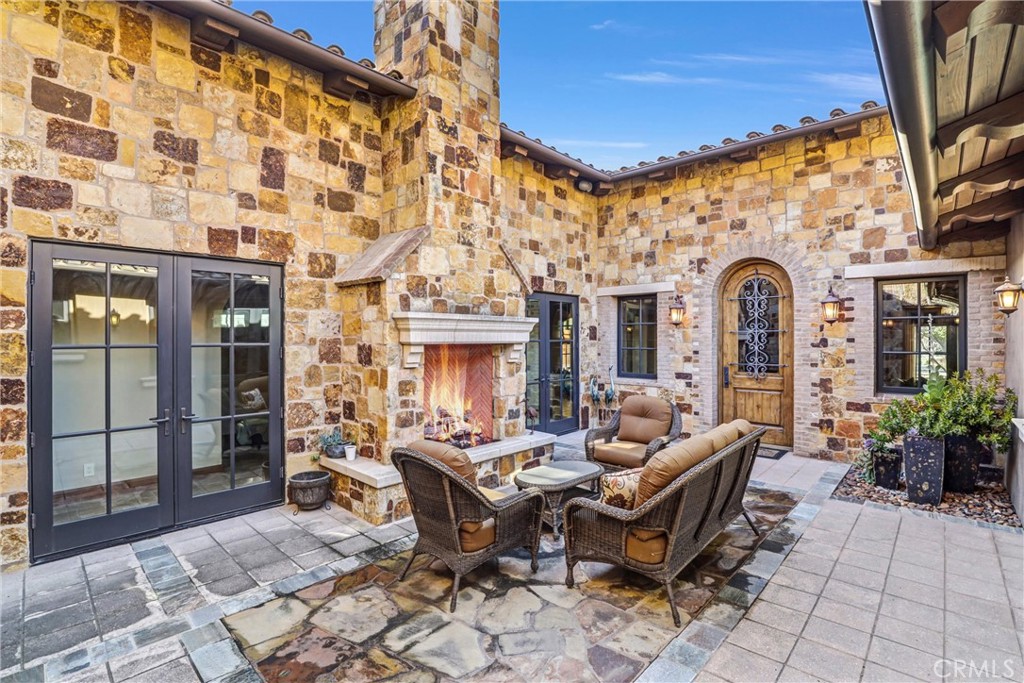 41 Needle Grass Irvine, CA 92603 - Photo 46 of 64 a view of a patio with couches table and chairs and potted plants